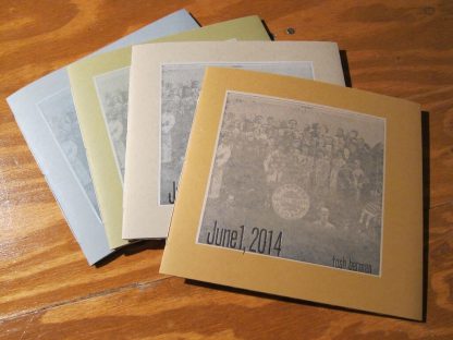 4 copies of Tosh Berman's book June 1, 2014, laying on a table