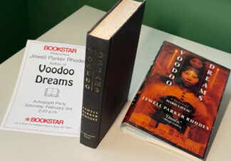 A picture of the signed / inscribed book by Jewell Parker Rhodes called Voodoo Dreams